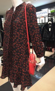 Black pintuck dress with red lips patterns by Whistles, Spring 2018 collection.